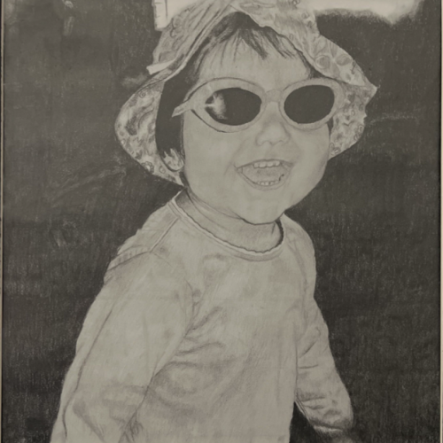 Pencil drawing of a smiling toddler wearing a bucket hat