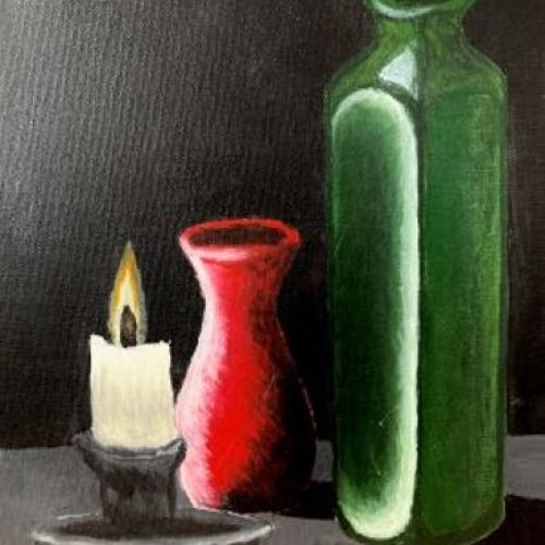 Two bottles, one green, one red with shadows and light against a black background