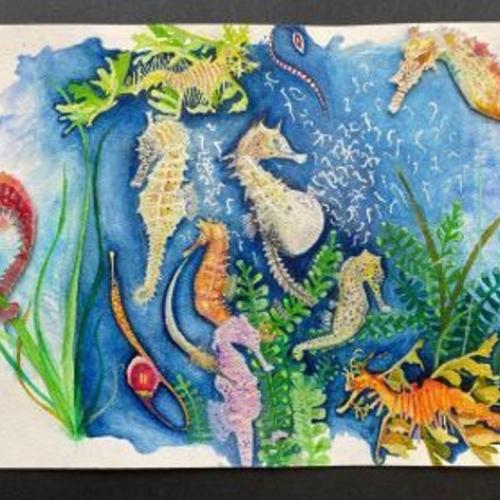 Watercolor painting of pastel seahorses against blue background