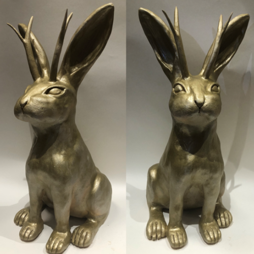 Ceramic creation of a jackalope rabbit painted gold