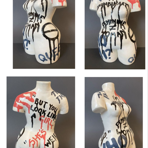 This ceramic piece is intended to show the pride and struggles of people whose gender identity does not match their outward gender expression. The ceramic body is white with partial arms, legs and neck. The graphic writing are statements of the internal struggle. 