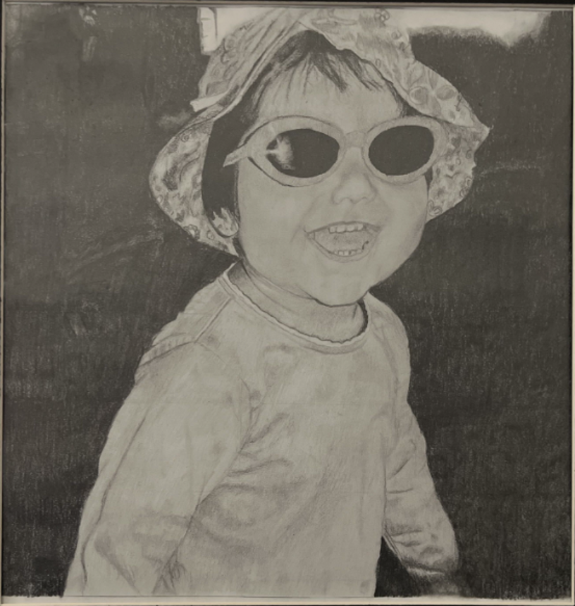 Pencil drawing of a smiling toddler wearing a bucket hat