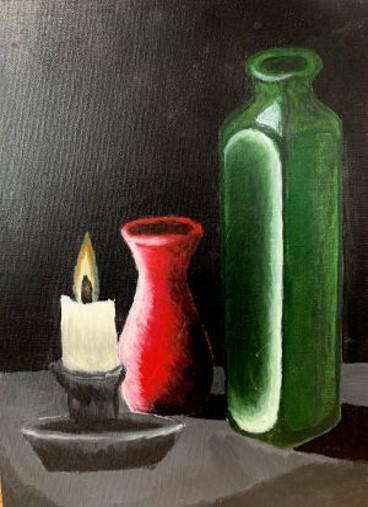 Two bottles, one green, one red with shadows and light against a black background