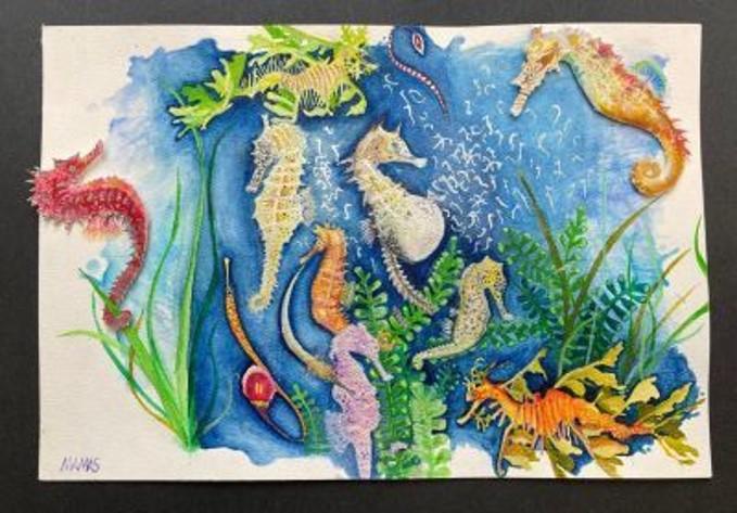 Watercolor painting of pastel seahorses against blue background